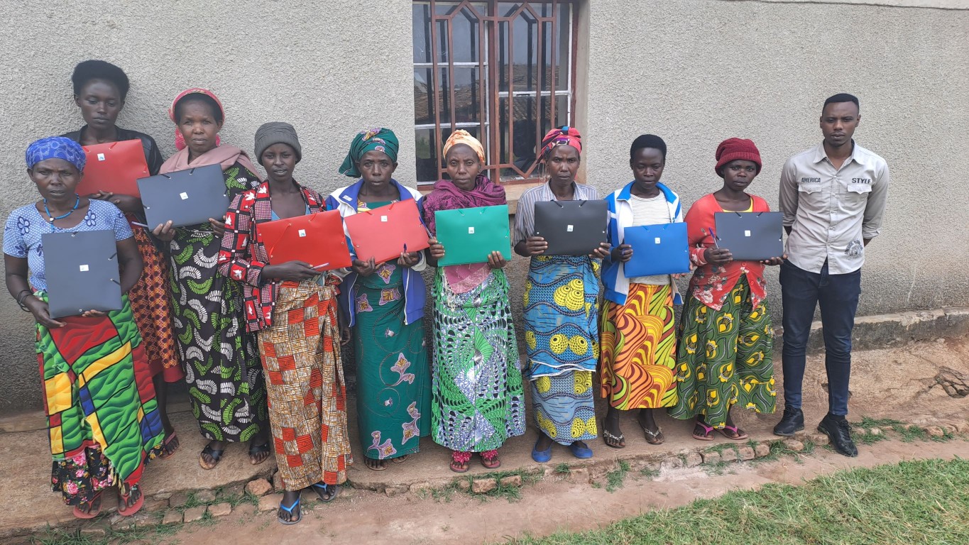 Mubuga adult literacy school members posed for photo after receiving school materials